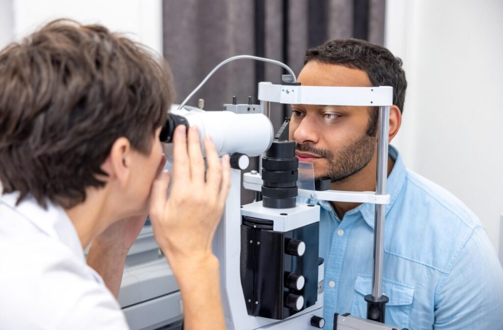 A patient having their eyes examined by an optometrist to monitor eye pressure.